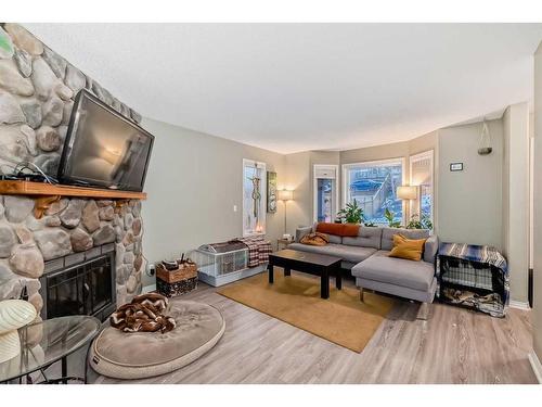 960 Wilson Way, Canmore, AB - Indoor Photo Showing Living Room With Fireplace