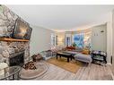 960 Wilson Way, Canmore, AB  - Indoor Photo Showing Living Room With Fireplace 