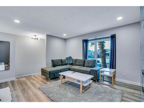 9 Sunvale Crescent Se, Calgary, AB - Indoor Photo Showing Living Room With Fireplace