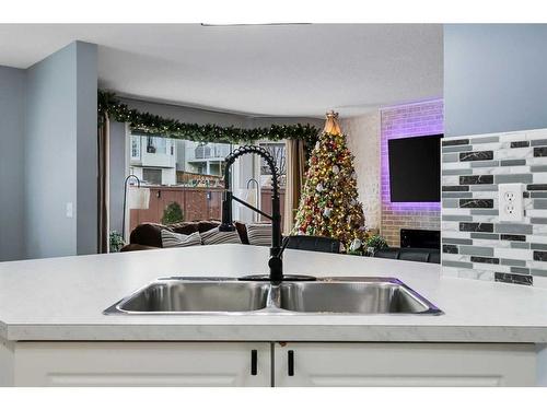 214 Evansmeade Point Nw, Calgary, AB - Indoor Photo Showing Kitchen With Double Sink