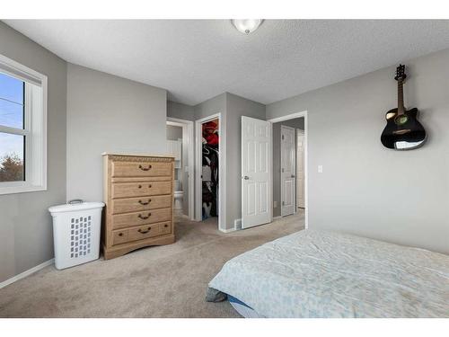 75 Bridlewood Avenue Sw, Calgary, AB - Indoor Photo Showing Bedroom