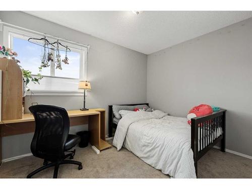 75 Bridlewood Avenue Sw, Calgary, AB - Indoor Photo Showing Bedroom