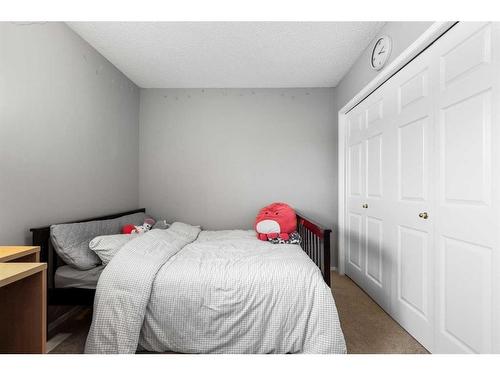 75 Bridlewood Avenue Sw, Calgary, AB - Indoor Photo Showing Bedroom