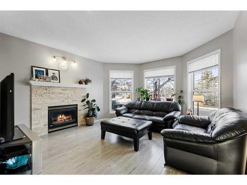 75 Bridlewood Avenue Sw, Calgary, AB - Indoor Photo Showing Living Room With Fireplace