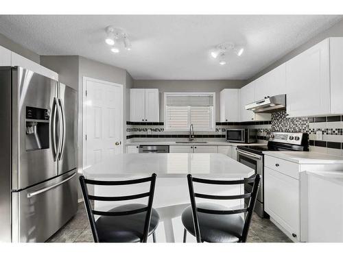 75 Bridlewood Avenue Sw, Calgary, AB - Indoor Photo Showing Kitchen With Stainless Steel Kitchen