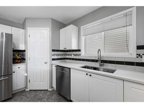 75 Bridlewood Avenue Sw, Calgary, AB - Indoor Photo Showing Kitchen With Stainless Steel Kitchen With Double Sink