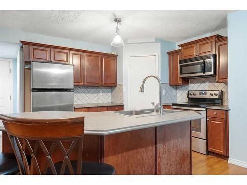 153 Somerset Way Sw, Calgary, AB - Indoor Photo Showing Kitchen With Double Sink