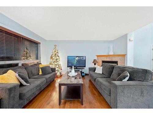 153 Somerset Way Sw, Calgary, AB - Indoor Photo Showing Living Room With Fireplace