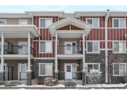 52 West Coach Manor Sw, Calgary, AB - Outdoor With Balcony With Facade