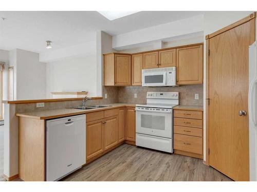 2253-151 Country Village Road Ne, Calgary, AB - Indoor Photo Showing Kitchen With Double Sink