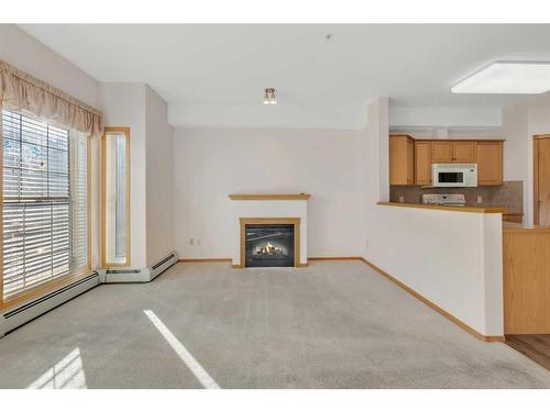 2253-151 Country Village Road Ne, Calgary, AB - Indoor With Fireplace