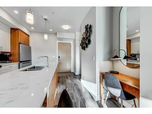 305-1702 17 Avenue Sw, Calgary, AB - Indoor Photo Showing Kitchen With Double Sink