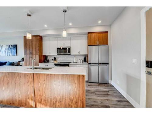 305-1702 17 Avenue Sw, Calgary, AB - Indoor Photo Showing Kitchen With Double Sink