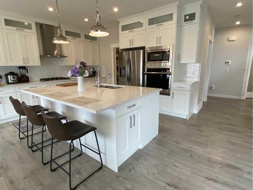 729 Mandalay Avenue Nw, Carstairs, AB - Indoor Photo Showing Kitchen With Double Sink With Upgraded Kitchen