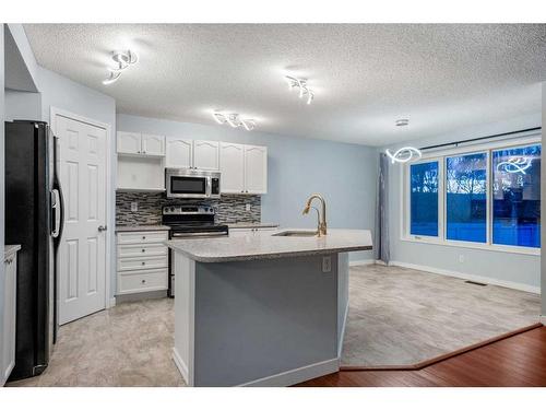 78 Evansmeade Circle Nw, Calgary, AB - Indoor Photo Showing Kitchen With Upgraded Kitchen