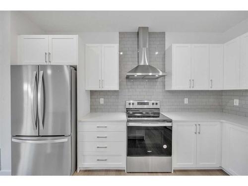 305 Baneberry Way Sw, Airdrie, AB - Indoor Photo Showing Kitchen With Stainless Steel Kitchen With Upgraded Kitchen