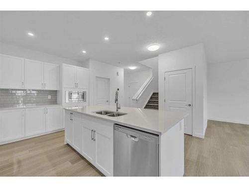 305 Baneberry Way Sw, Airdrie, AB - Indoor Photo Showing Kitchen With Double Sink With Upgraded Kitchen