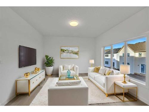 305 Baneberry Way Sw, Airdrie, AB - Indoor Photo Showing Living Room