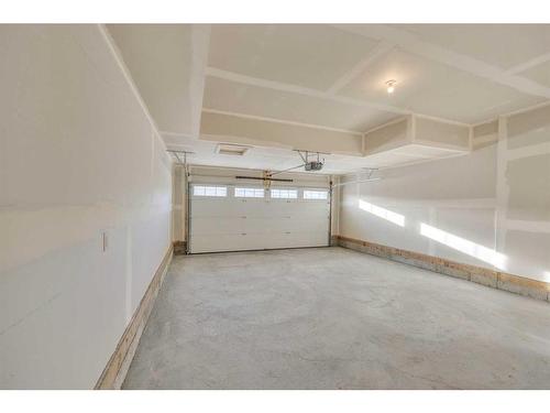 305 Baneberry Way Sw, Airdrie, AB - Indoor Photo Showing Garage