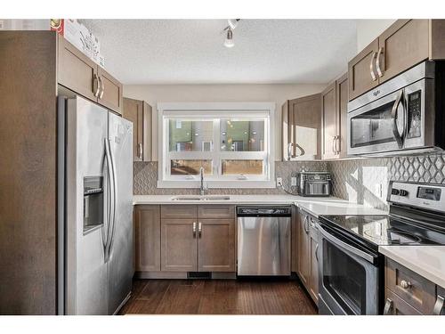 1602-2461 Baysprings Link Sw, Airdrie, AB - Indoor Photo Showing Kitchen With Double Sink