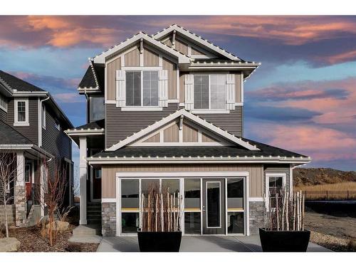 91 Sundown Crescent, Cochrane, AB - Outdoor With Facade