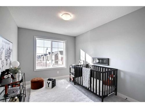 91 Sundown Crescent, Cochrane, AB - Indoor Photo Showing Bedroom