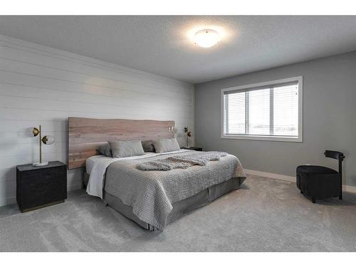 91 Sundown Crescent, Cochrane, AB - Indoor Photo Showing Bedroom