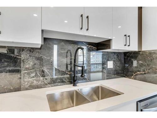 61-116 Silver Crest Drive Nw, Calgary, AB - Indoor Photo Showing Kitchen With Double Sink