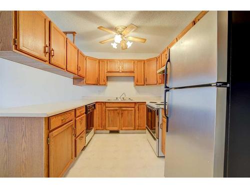 72 Sandarac Circle Nw, Calgary, AB - Indoor Photo Showing Kitchen With Double Sink