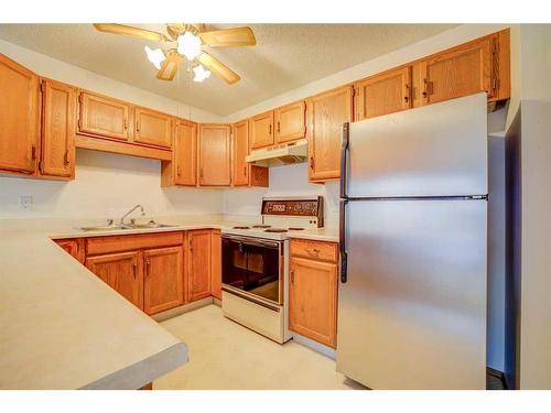 72 Sandarac Circle Nw, Calgary, AB - Indoor Photo Showing Kitchen With Double Sink