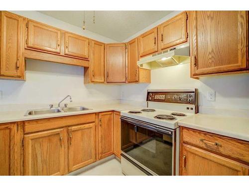 72 Sandarac Circle Nw, Calgary, AB - Indoor Photo Showing Kitchen With Double Sink