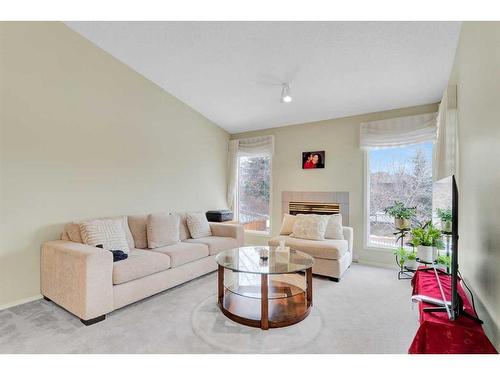 4 Sierra Vista Circle Sw, Calgary, AB - Indoor Photo Showing Living Room With Fireplace