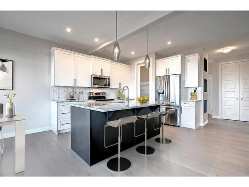 123 Waterford Manor, Chestermere, AB - Indoor Photo Showing Kitchen With Upgraded Kitchen