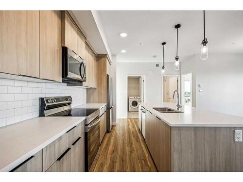 3307-220 Seton Grove Se, Calgary, AB - Indoor Photo Showing Kitchen With Double Sink With Upgraded Kitchen