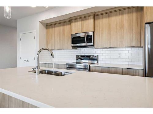 3307-220 Seton Grove Se, Calgary, AB - Indoor Photo Showing Kitchen With Double Sink With Upgraded Kitchen