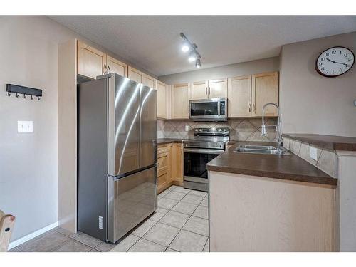 5305-69 Country Village Manor Ne, Calgary, AB - Indoor Photo Showing Kitchen With Stainless Steel Kitchen With Double Sink