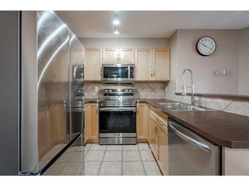 5305-69 Country Village Manor Ne, Calgary, AB - Indoor Photo Showing Kitchen With Stainless Steel Kitchen With Double Sink