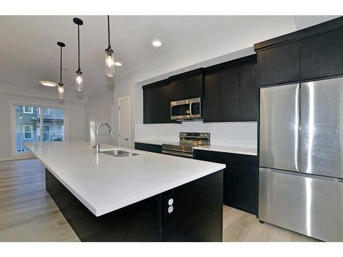 2206-220 Seton Grove Se, Calgary, AB - Indoor Photo Showing Kitchen With Stainless Steel Kitchen With Double Sink With Upgraded Kitchen