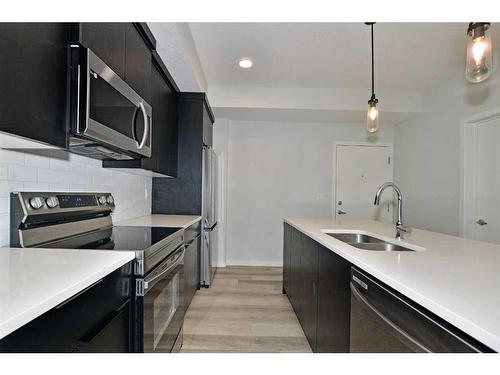 2206-220 Seton Grove Se, Calgary, AB - Indoor Photo Showing Kitchen With Stainless Steel Kitchen With Double Sink With Upgraded Kitchen