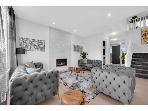 608 West Lakeview Drive, Chestermere, AB - Indoor Photo Showing Living Room With Fireplace