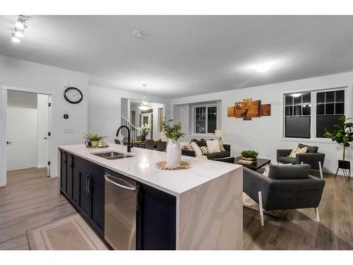 901 Windsong Drive Sw, Airdrie, AB - Indoor Photo Showing Kitchen With Double Sink