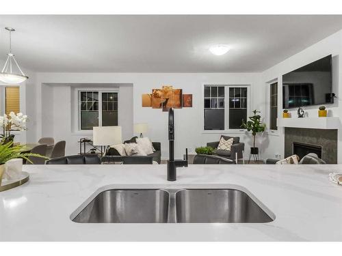 901 Windsong Drive Sw, Airdrie, AB - Indoor Photo Showing Kitchen With Double Sink