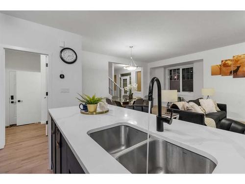 901 Windsong Drive Sw, Airdrie, AB - Indoor Photo Showing Kitchen With Double Sink