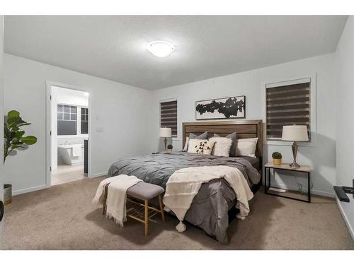 901 Windsong Drive Sw, Airdrie, AB - Indoor Photo Showing Bedroom