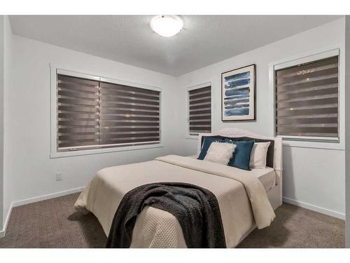 901 Windsong Drive Sw, Airdrie, AB - Indoor Photo Showing Bedroom