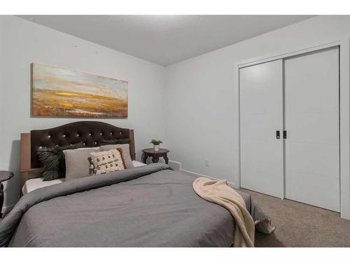 901 Windsong Drive Sw, Airdrie, AB - Indoor Photo Showing Bedroom