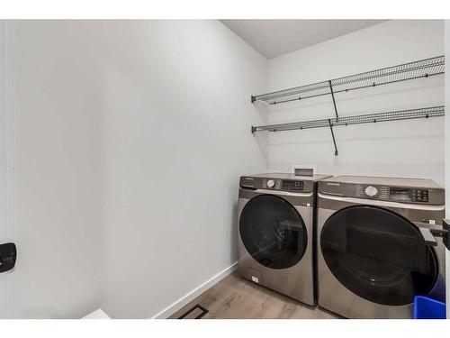 901 Windsong Drive Sw, Airdrie, AB - Indoor Photo Showing Laundry Room