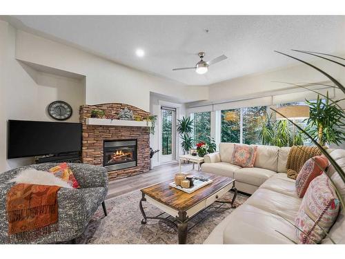 505-10 Discovery Ridge Close Sw, Calgary, AB - Indoor Photo Showing Living Room With Fireplace