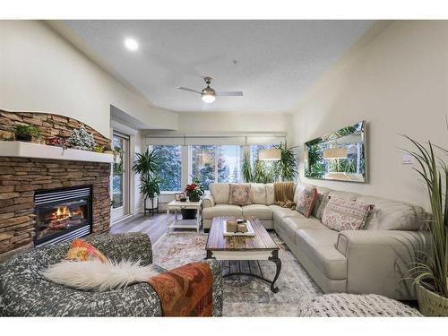 505-10 Discovery Ridge Close Sw, Calgary, AB - Indoor Photo Showing Living Room With Fireplace