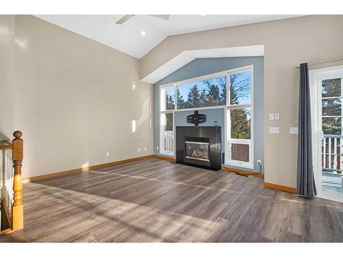 1721 Harrison Street, Crossfield, AB - Indoor Photo Showing Living Room With Fireplace